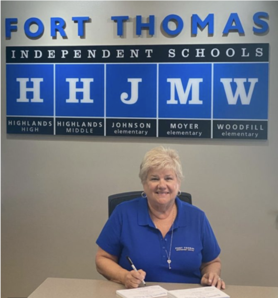 Meyer being signed to her position on the board upon election (Hilltopper). 
